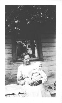 This is Raymond (Benton) with an unidentified woman, possibly the woman whose house Mother and Dad were living in. As Preachers they would live with a church family in whatever place they were working.